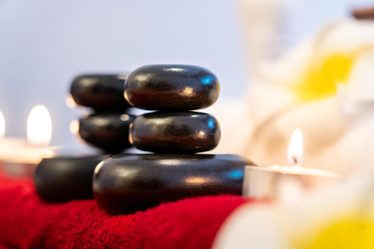 Majestic Arjaan By Rotana - Manama Aparthotel Exterior photo A stack of massage stones